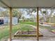 Spacious backyard features a lush green lawn, storage shed, and a charming walkway at 521 Florida Ave, St Cloud, FL 34769