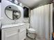 Charming bathroom features a stylish vanity, round mirror, and decorative accents at 521 Florida Ave, St Cloud, FL 34769