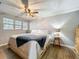 Inviting bedroom with natural light, ceiling fan, and stylish furnishings at 521 Florida Ave, St Cloud, FL 34769