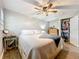 Bright and airy bedroom with large windows, a ceiling fan, and ample closet space at 521 Florida Ave, St Cloud, FL 34769