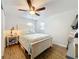 Comfortable bedroom with a wooden bed frame and a ceiling fan at 521 Florida Ave, St Cloud, FL 34769