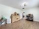 Dining room with hardwood floors, stylish buffet, and a view into the kitchen at 521 Florida Ave, St Cloud, FL 34769