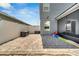Backyard featuring a brick patio and outdoor features with an enclosed screened porch at 5640 Silver Thistle Ln, St Cloud, FL 34772