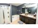 Primary bathroom featuring double sinks, a soaking tub, and separate shower at 5640 Silver Thistle Ln, St Cloud, FL 34772