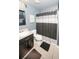 Bathroom featuring a single sink vanity, toilet, and shower with neutral tones at 5640 Silver Thistle Ln, St Cloud, FL 34772