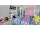 This bedroom features bright light, modern decor, and a TV at 5640 Silver Thistle Ln, St Cloud, FL 34772