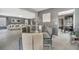 Open dining area with seating for six, seamlessly connected to the living room and kitchen spaces at 5640 Silver Thistle Ln, St Cloud, FL 34772