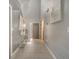 Bright foyer with tile floors, grey walls, modern decor, and a view of the staircase at 5640 Silver Thistle Ln, St Cloud, FL 34772