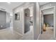 Hallway leading to a bedroom and playroom, offering seamless connectivity between spaces at 5640 Silver Thistle Ln, St Cloud, FL 34772