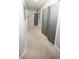 Hallway features carpet floors, closet, and gray doors with hardware at 5640 Silver Thistle Ln, St Cloud, FL 34772