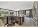 Kitchen island with stainless steel appliances and granite countertops, overlooking a serene outdoor view at 5640 Silver Thistle Ln, St Cloud, FL 34772