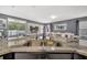 Granite countertop in a modern kitchen with a stainless steel sink overlooking the bright living area at 5640 Silver Thistle Ln, St Cloud, FL 34772