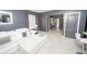 View of modern living area with white tile flooring and contemporary decor at 5640 Silver Thistle Ln, St Cloud, FL 34772
