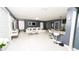 Open-concept living area with modern finishes, a breakfast bar, and stainless steel appliances at 5640 Silver Thistle Ln, St Cloud, FL 34772