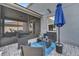 Screened patio with outdoor seating and a view of the fenced yard at 5640 Silver Thistle Ln, St Cloud, FL 34772