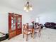 Cozy dining area with classic furniture, ideal for intimate gatherings at 707 Divot Ln, Poinciana, FL 34759