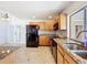 Well-equipped kitchen featuring stainless steel appliances, granite countertops, and ample cabinet space at 707 Divot Ln, Poinciana, FL 34759