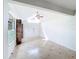 Spacious living area offering neutral tones, ceramic tile, vaulted ceilings, and natural light at 707 Divot Ln, Poinciana, FL 34759