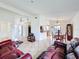 Open-concept living room and dining area with tile flooring and plenty of natural light at 707 Divot Ln, Poinciana, FL 34759