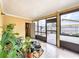 Enclosed patio featuring tile flooring and access to the backyard, perfect for outdoor relaxing at 707 Divot Ln, Poinciana, FL 34759