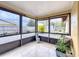 Enclosed patio offers a view of the backyard, perfect for enjoying the outdoor scenery at 707 Divot Ln, Poinciana, FL 34759