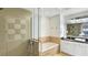 Bathroom with a glass shower, soaking tub, vanity with sink, and tiled backsplash at 7602 Cabana Ct # 101, Reunion, FL 34747