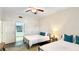 Bedroom featuring two beds and an ensuite bathroom at 7602 Cabana Ct # 101, Reunion, FL 34747