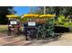 Colorful four-person bikes with yellow canopies are parked for use at this resort at 7602 Cabana Ct # 101, Reunion, FL 34747