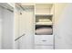 Walk-in closet with ample storage, including shelving, drawers, and hanging rods at 7602 Cabana Ct # 101, Reunion, FL 34747
