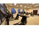 Fitness center featuring modern cardio equipment with beautiful arched windows at 7602 Cabana Ct # 101, Reunion, FL 34747