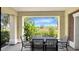 Charming outdoor patio with table and chairs, offering a lovely spot for relaxation and dining at 7602 Cabana Ct # 101, Reunion, FL 34747