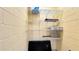 A bare, open storage area featuring wire shelves and a security television monitor at 7602 Cabana Ct # 101, Reunion, FL 34747