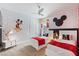 Themed bedroom with two twin beds, playful wall decor, and cheerful accents for a delightful space at 7649 Wilmington Loop, Kissimmee, FL 34747