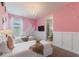 Charming bedroom with twin beds, chandelier, and access to en-suite bathroom at 7649 Wilmington Loop, Kissimmee, FL 34747
