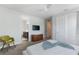 Modern bedroom with a large bed, stylish decor, and attached bathroom at 7649 Wilmington Loop, Kissimmee, FL 34747