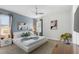 Modern bedroom with a large bed, stylish decor, and lots of natural light at 7649 Wilmington Loop, Kissimmee, FL 34747