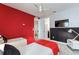 Bright themed bedroom featuring twin beds, unique wall decor, and an ensuite bathroom entrance at 7649 Wilmington Loop, Kissimmee, FL 34747