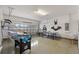 Fun game room featuring ping pong, foosball, and murals, offering entertainment for the whole Gathering at 7649 Wilmington Loop, Kissimmee, FL 34747
