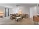 Spacious living room with ceiling fan, comfortable sofas, and lots of natural light at 7649 Wilmington Loop, Kissimmee, FL 34747