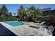 Beautiful backyard oasis with a private pool, spa, and tropical landscaping at 7649 Wilmington Loop, Kissimmee, FL 34747