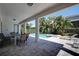 Expansive covered patio overlooking the pool and backyard, perfect for outdoor living and entertaining at 7649 Wilmington Loop, Kissimmee, FL 34747