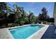 Private backyard pool and spa with mature landscaping and a peaceful setting at 7649 Wilmington Loop, Kissimmee, FL 34747