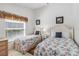 Bright guest bedroom with two beds, perfect for a Gathering stay at 7706 Water Oak Ct, Kissimmee, FL 34747