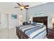 Bedroom featuring a ceiling fan, a comfortable bed, and tiled floors for a cool and comfortable feel at 7706 Water Oak Ct, Kissimmee, FL 34747