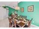Inviting dining room with seating for six and elegant chandelier at 7706 Water Oak Ct, Kissimmee, FL 34747