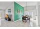 Cozy dining area features a vibrant accent wall, tile flooring, and sliding glass doors at 7706 Water Oak Ct, Kissimmee, FL 34747
