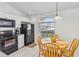 Cozy kitchen nook with a round wooden table and natural lighting at 7706 Water Oak Ct, Kissimmee, FL 34747