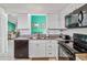 Open kitchen with stainless steel appliances and granite countertops at 7706 Water Oak Ct, Kissimmee, FL 34747