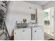 Bright laundry area featuring a side-by-side washer and dryer and utility access at 7706 Water Oak Ct, Kissimmee, FL 34747