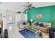 Cozy living room featuring a ceiling fan, tile flooring, and a view of the entryway at 7706 Water Oak Ct, Kissimmee, FL 34747